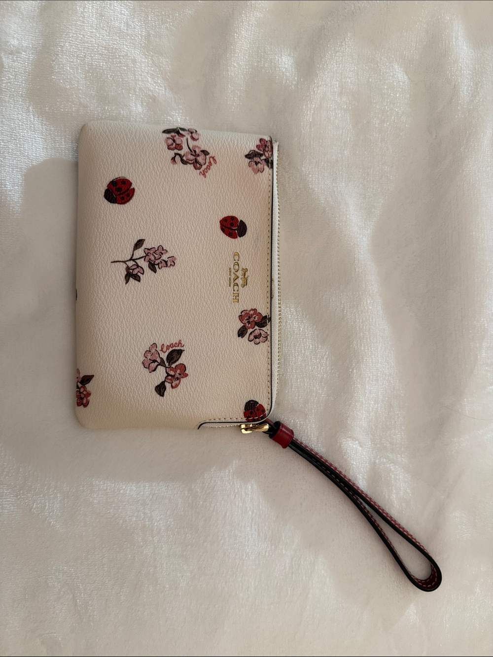 Coach Cream Floral Leather Wristlet with Red Accents